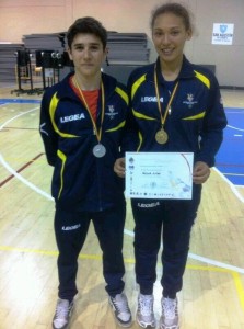 Liam Aguilar y Regina Julia, plata y oro en el nacional cadete de lucha olímpica.