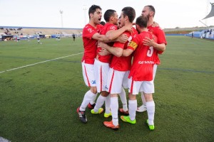 Jugadores del CD Ibiza celebran la consecución de un tanto